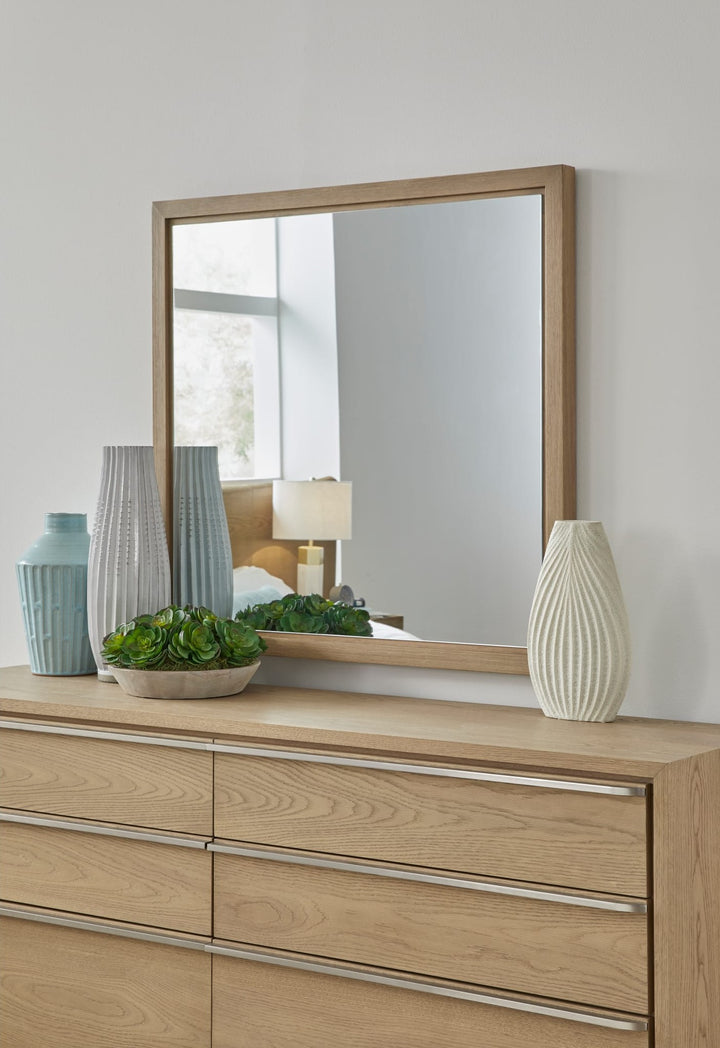 One Coastal Dresser Mirror in Bisque — styled on the matching dresser (sold separately)