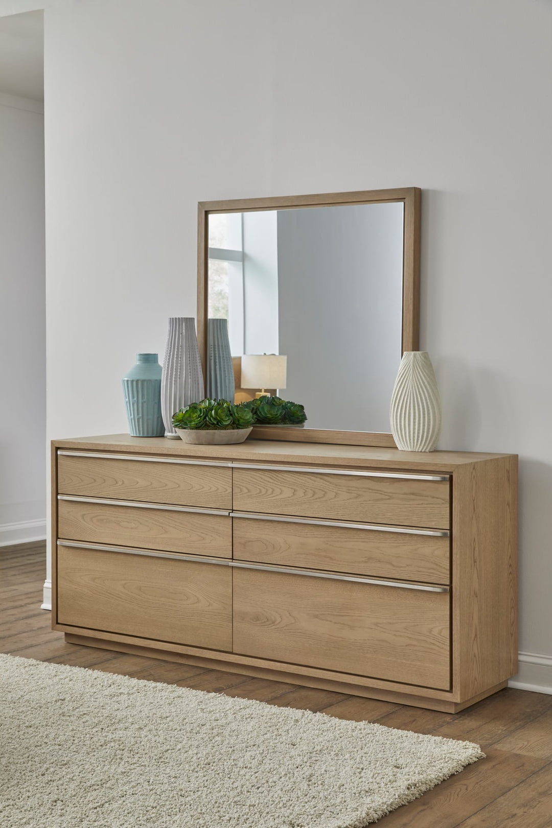 One Coastal Dresser Mirror in Bisque — styled on the matching dresser (sold separately)