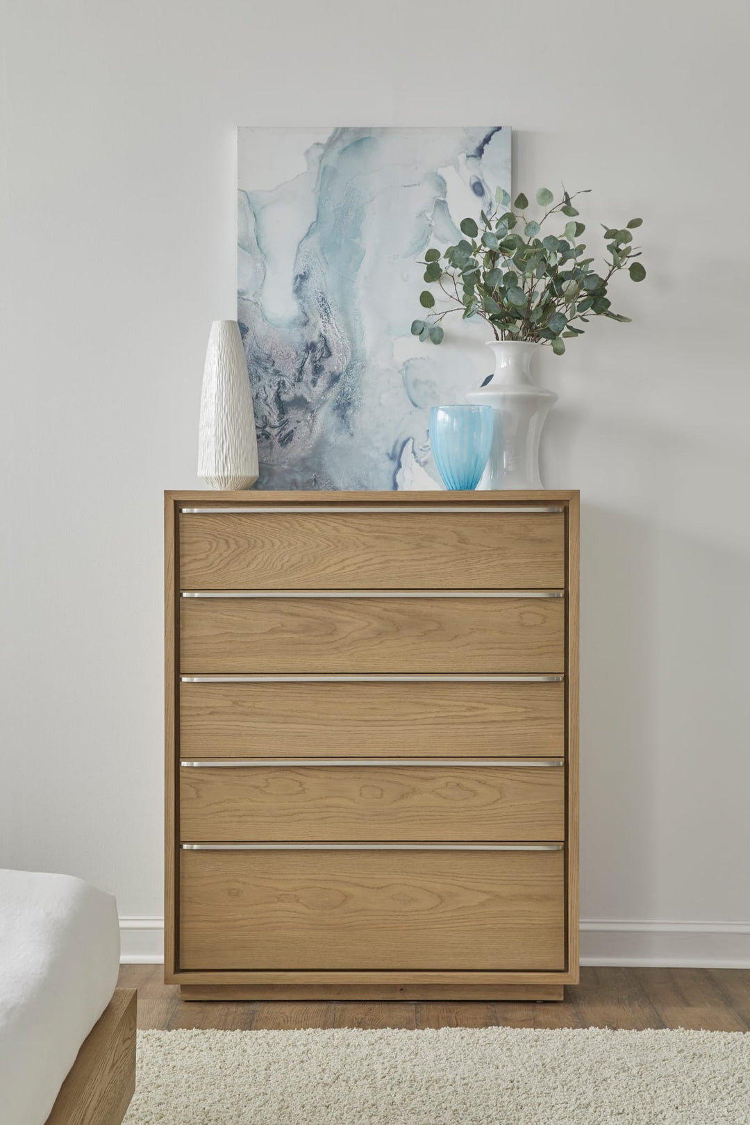 One Coastal Five Drawer Chest in Bisque — styled in a room
