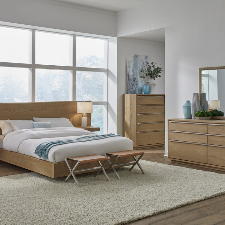 One Coastal Five Drawer Chest in Bisque — in a bedroom setting