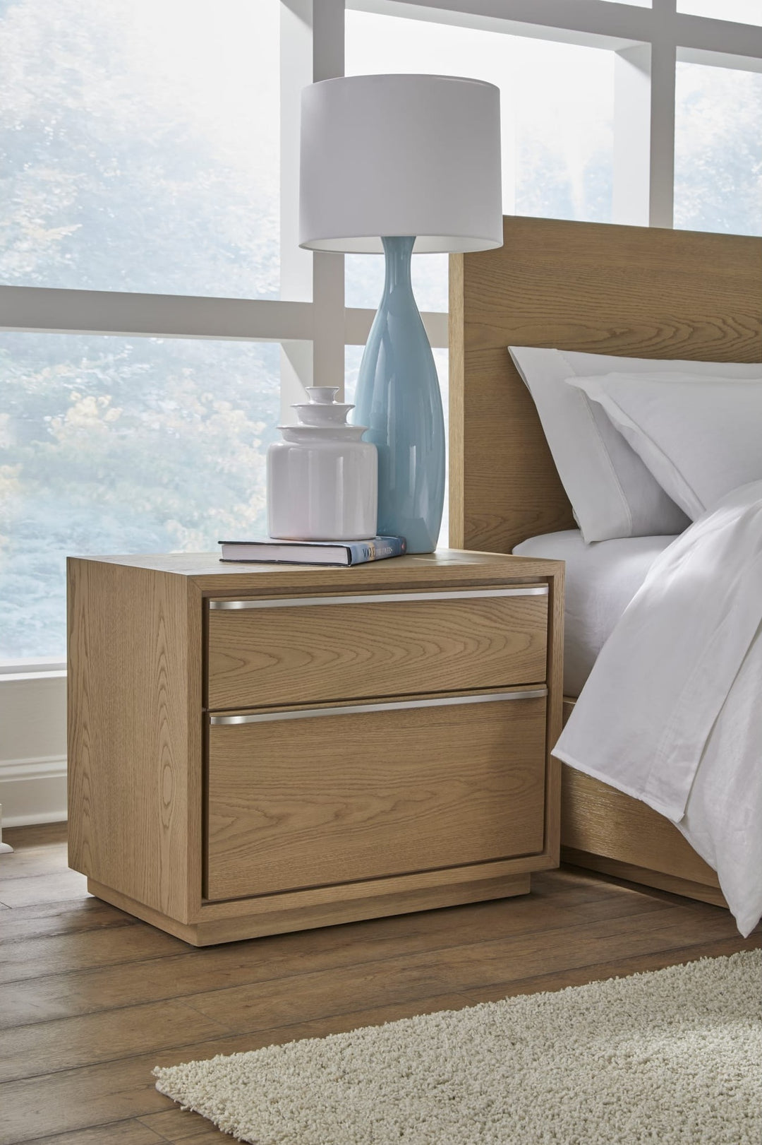 One Coastal Two Drawer USB-Charging Nightstand in Bisque — in a bedroom setting