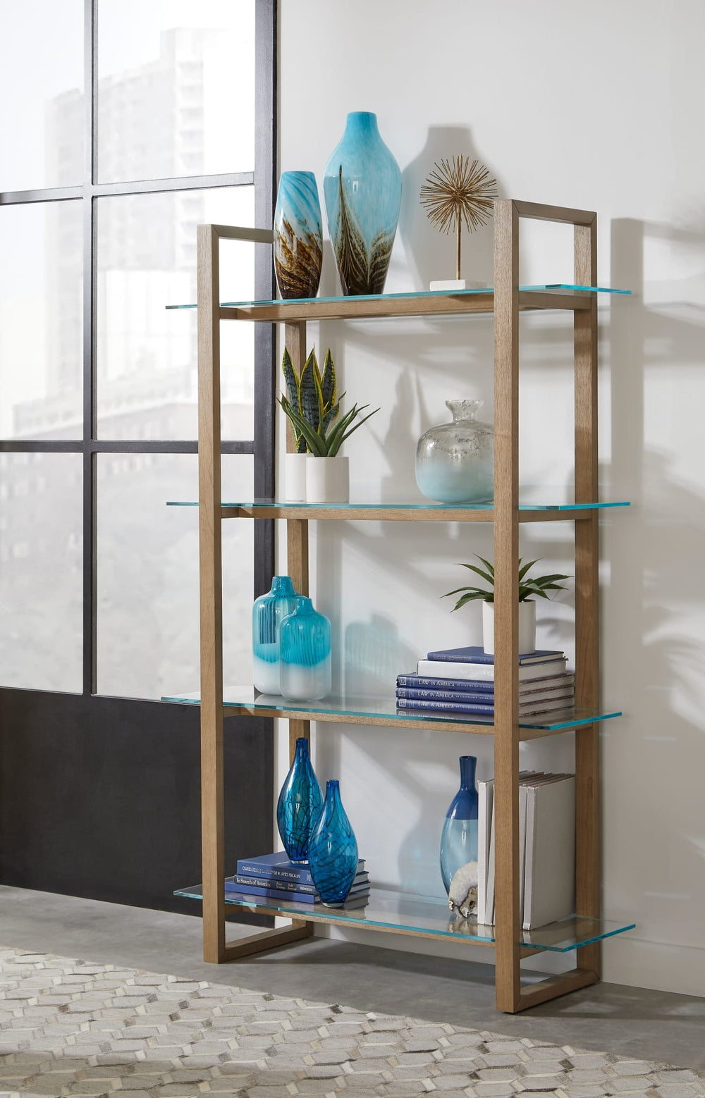 One Modern Coastal Glass Shelf Bookcase in Bisque — lifestyle photo