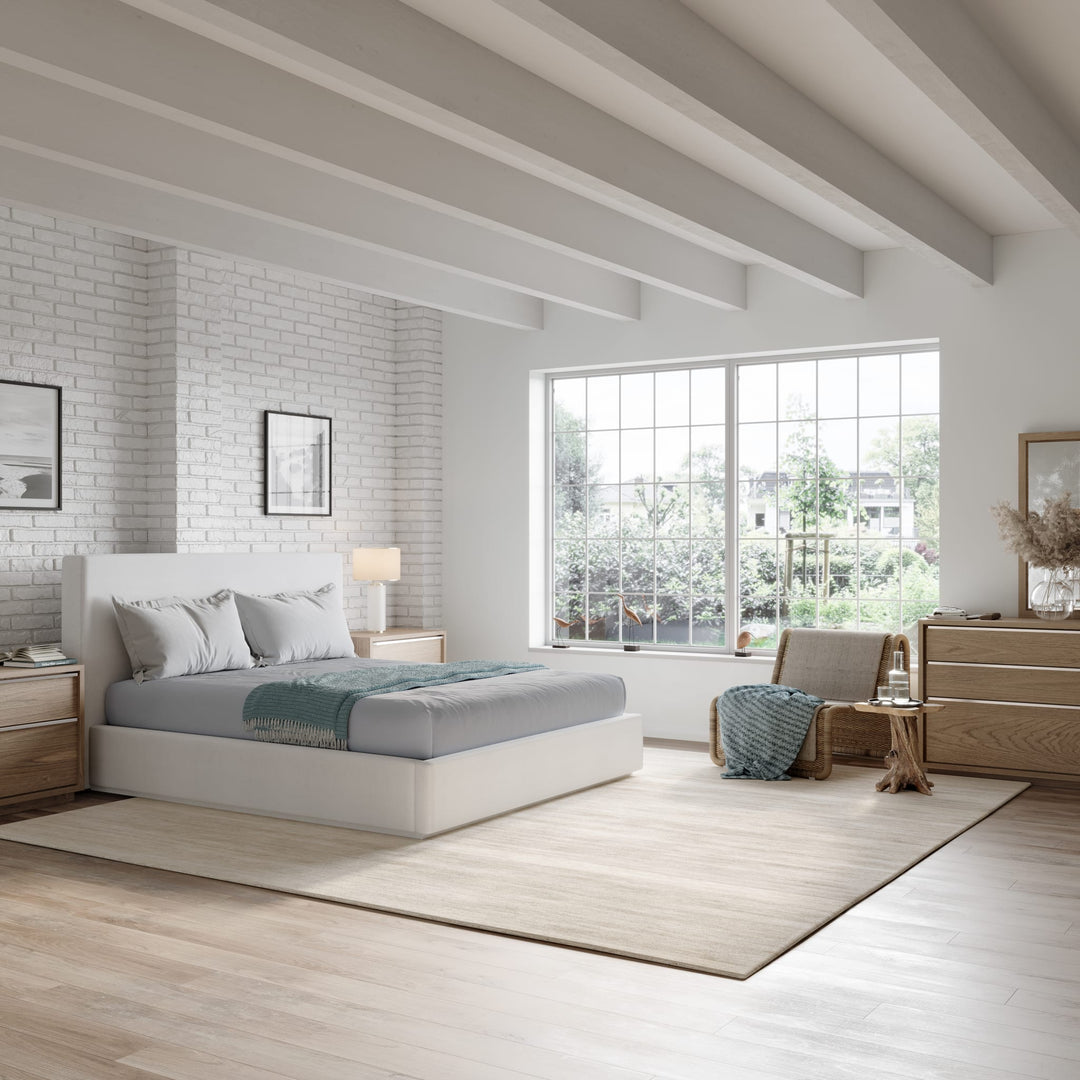 One Upholstered Footboard Storage Bed in Pearl styled in a bedroom