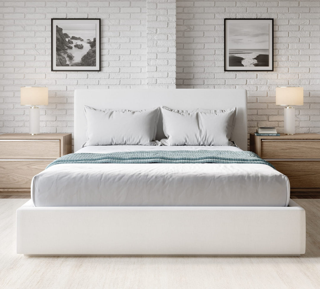 One Upholstered Platform Bed in Pearl styled in a bedroom