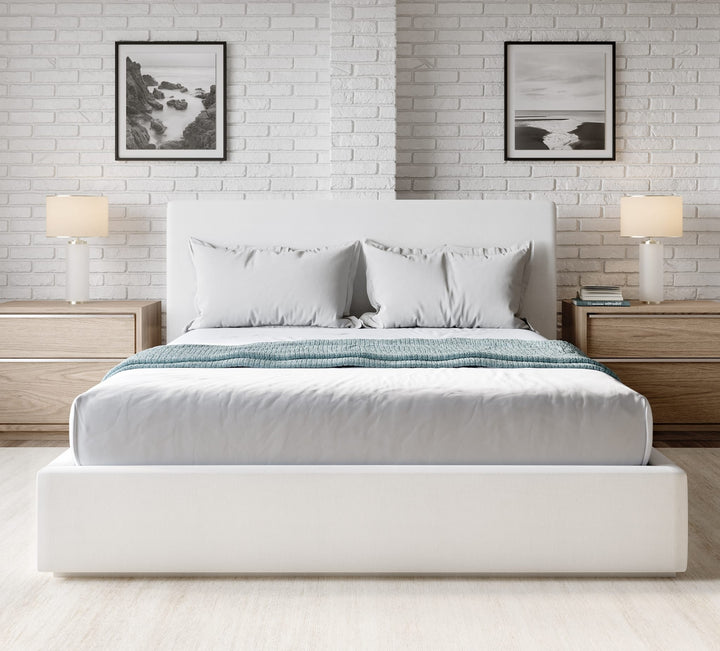 One Upholstered Platform Bed in Pearl styled in a bedroom