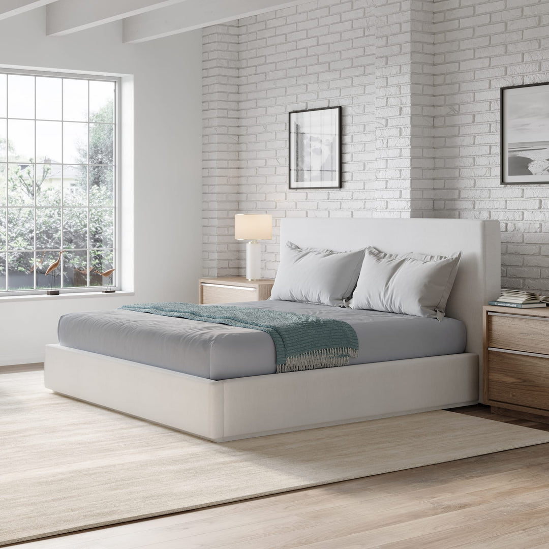 One Upholstered Platform Bed in Pearl styled in a bedroom