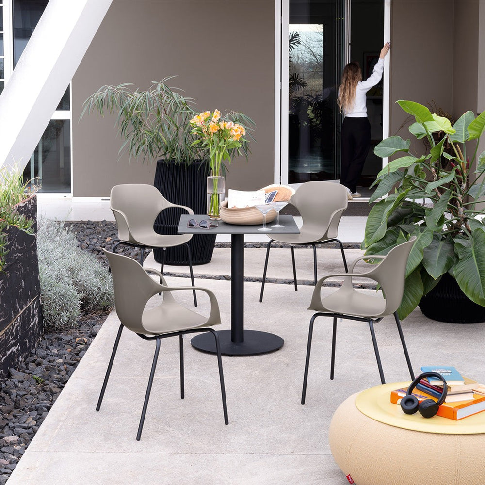 Ops! Outdoor Dining Armchair by Connubia in a styled interior