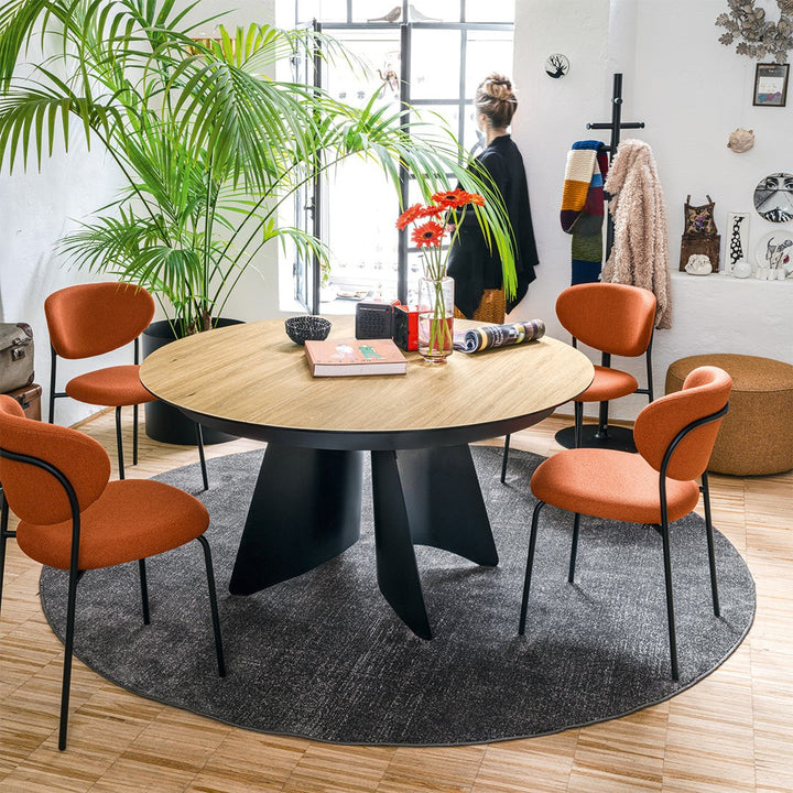 Orion Round Extendable Dining Table by Connubia in a styled interior