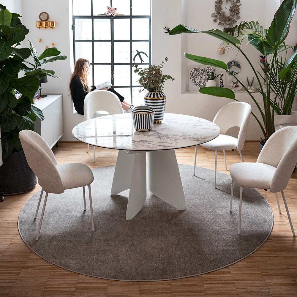 Orion Round Extendable Dining Table by Connubia in a styled interior