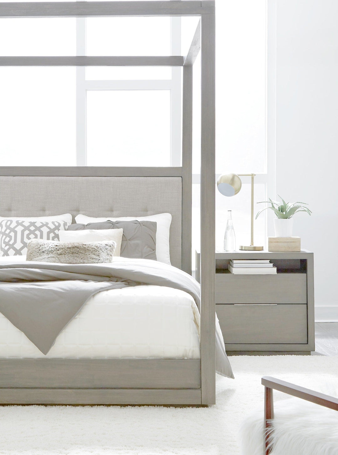 Oxford Upholstered Canopy Bed in Mineral styled in a bedroom