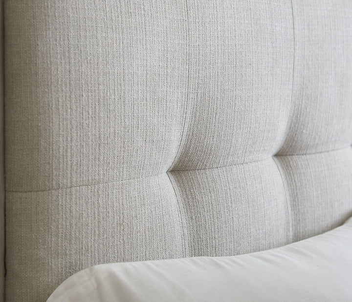 Oxford Upholstered Footboard Storage Bed in Mineral — close-up of the button-tufted headboard