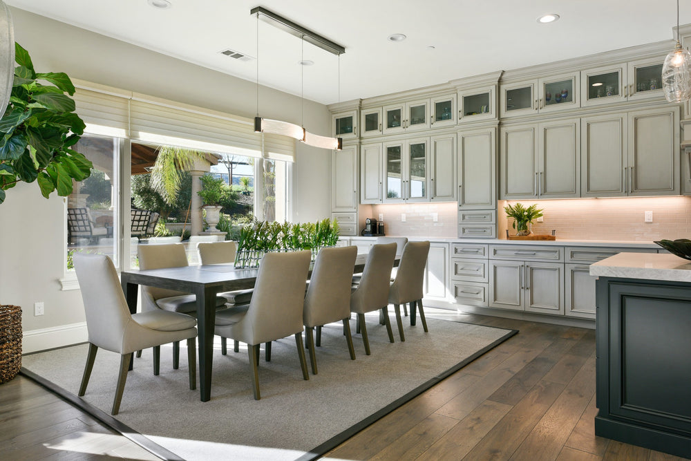 Parallel Curved Linear Chandelier by Hammerton Studio in a styled interior