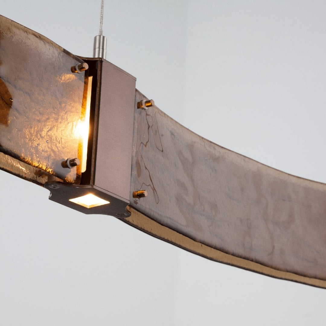 Parallel Curved Linear Chandelier by Hammerton Studio in a styled interior