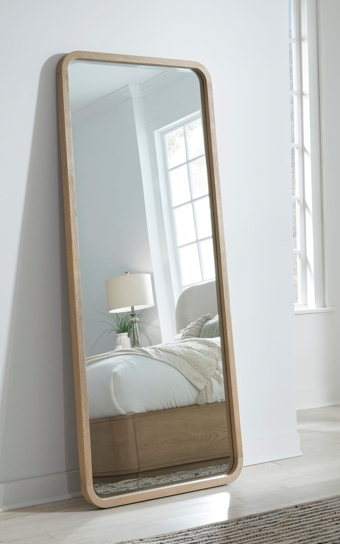 Penny Floor Mirror in Buff Cream — styled in a room