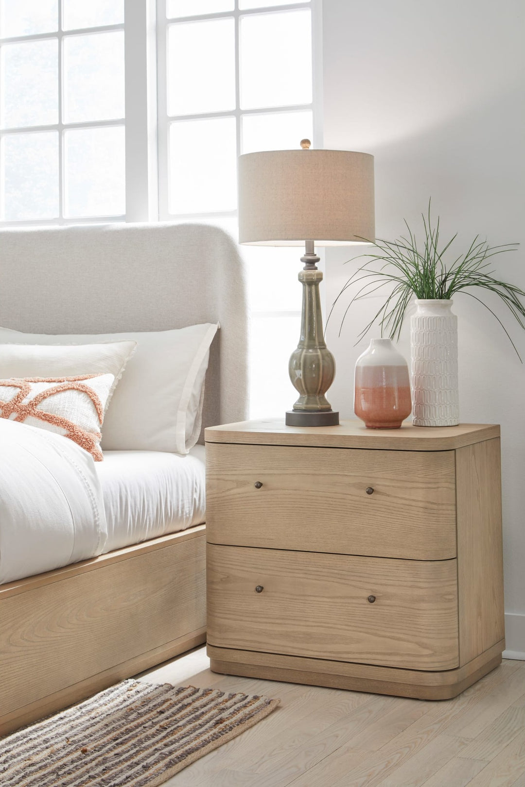 Penny Two Drawer Nightstand in Buff Cream — styled in a room