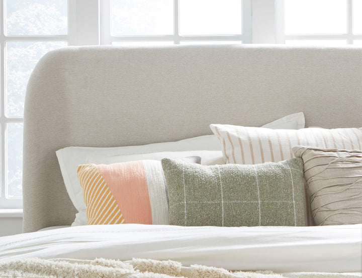 Penny Upholstered Platform Bed in Buff Cream styled in a bedroom