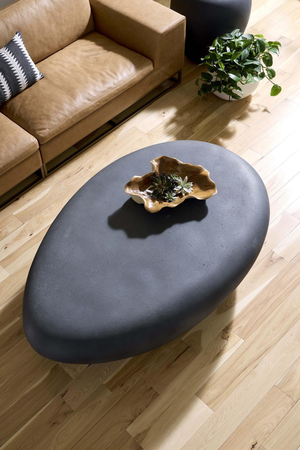 River Stone Coffee Table, Charcoal Stone, Extra Large by Phillips Collection — room setting