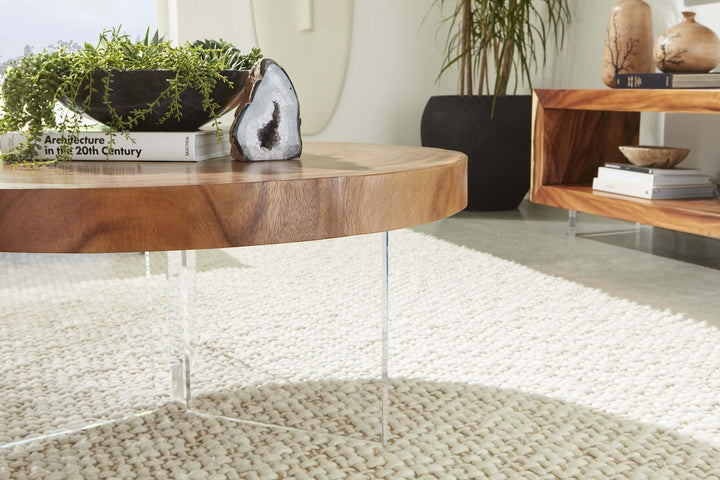 Floating Round Coffee Table With Acrylic Legs, Natural by Phillips Collection — room setting