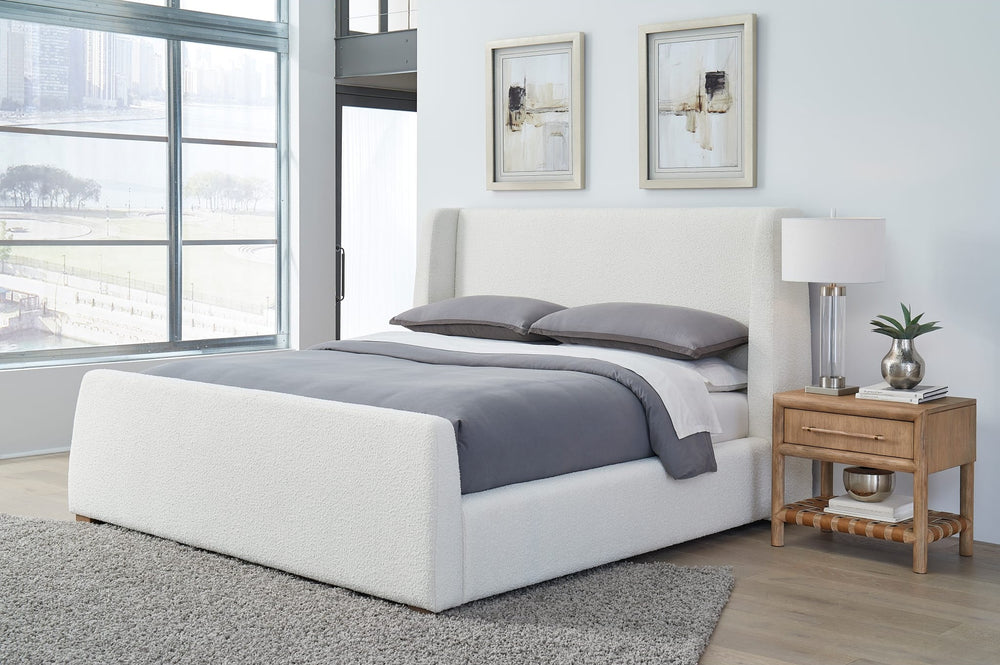 Presley Upholstered Wingback Platform Bed in Cottage Cheese Boucle styled in a bedroom