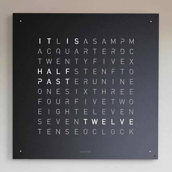 QLOCKTWO EARTH 180 Black Pepper word clock mounted on a light wall, close front view