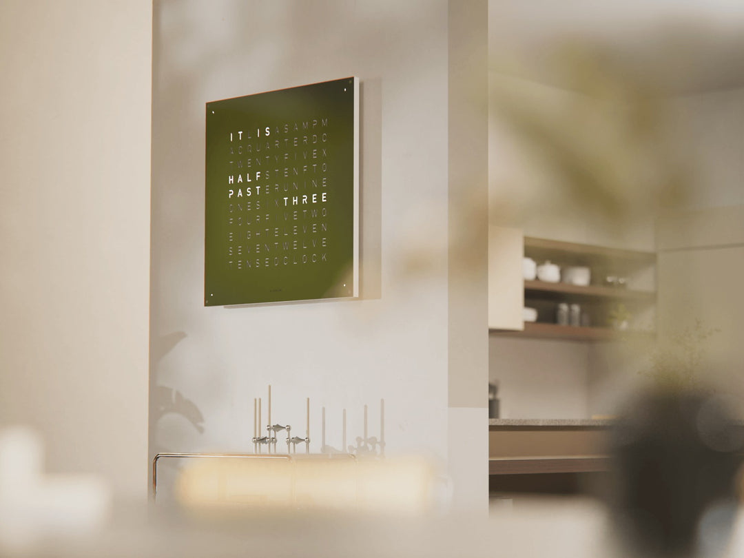 QLOCKTWO EARTH 90 Olive large word clock in a living room