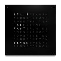 QLOCKTWO EARTH 90 wall clock in Black Pepper with illuminated words, front view