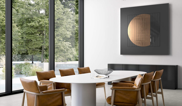 QLOCKTWO MOON 180 Nightfall Moon Gold above a dining table
