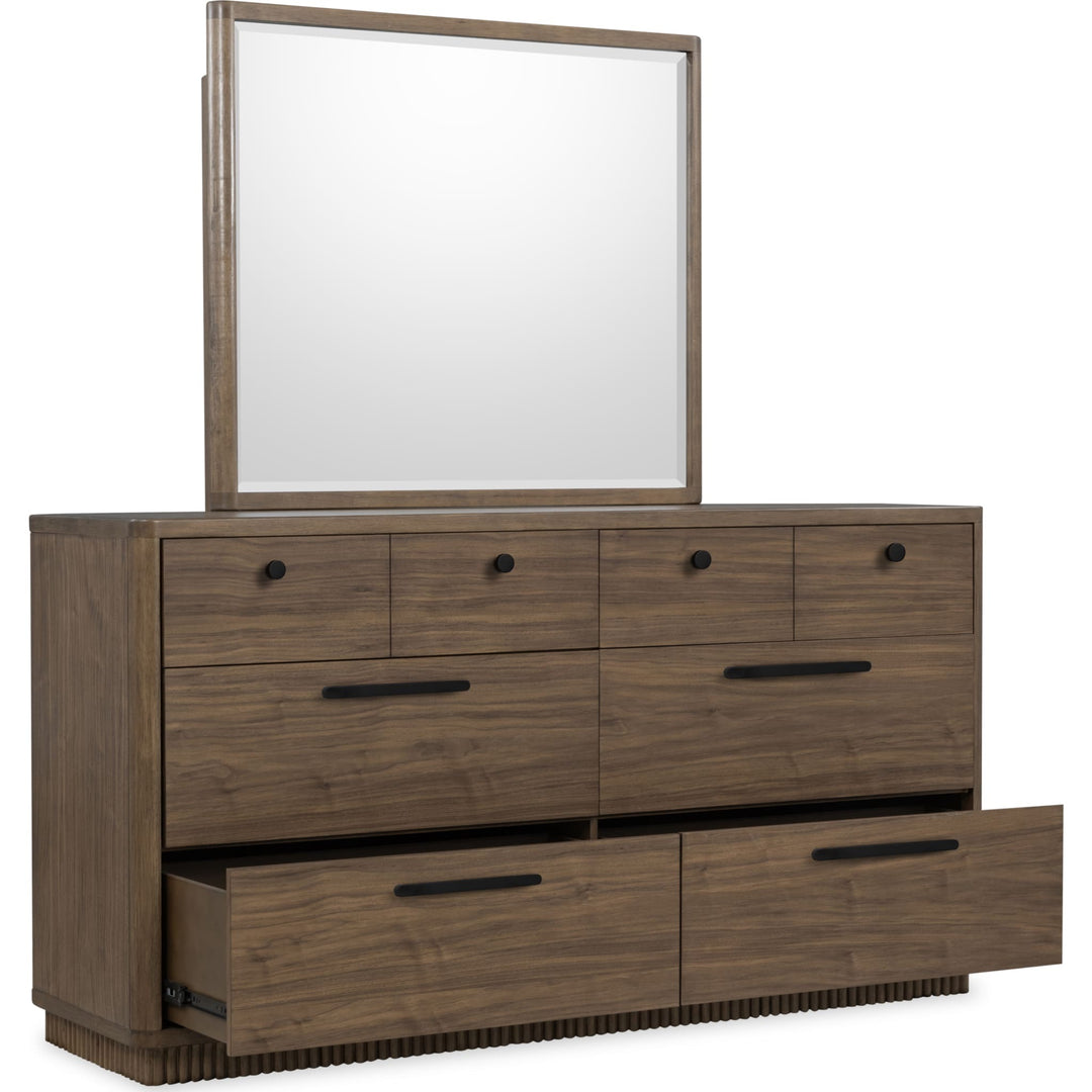 Ravelle Dresser in Walnut Grove — with drawers open, shown with the matching mirror (sold separately)