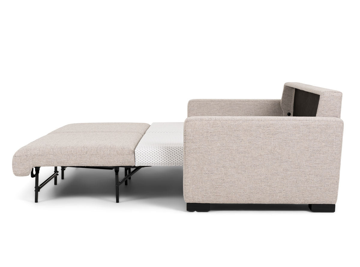 American Leather sleeper sofa opened in a contemporary lifestyle setting