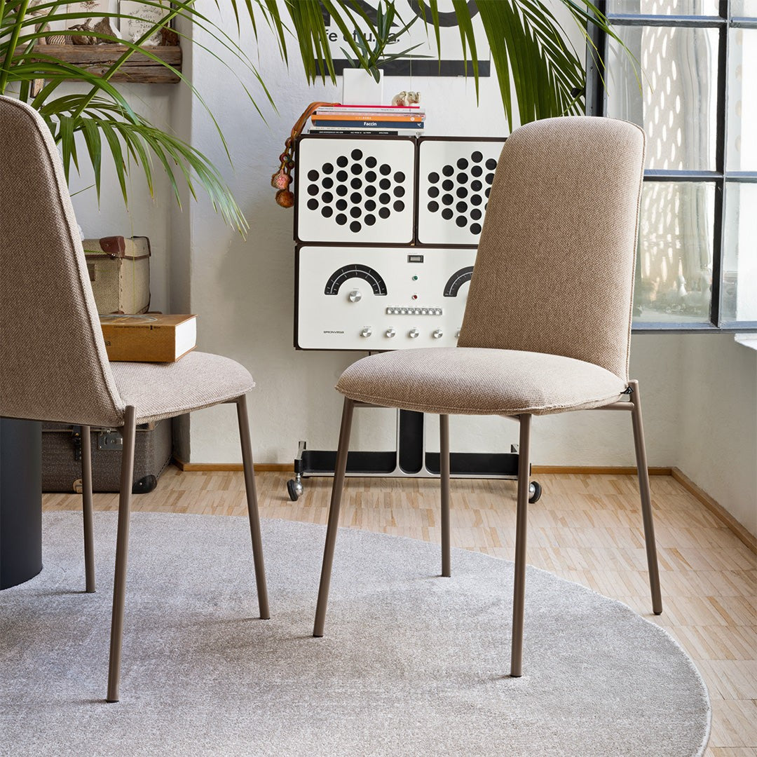 Riley Metal Upholstered Dining Chair by Connubia in a styled interior