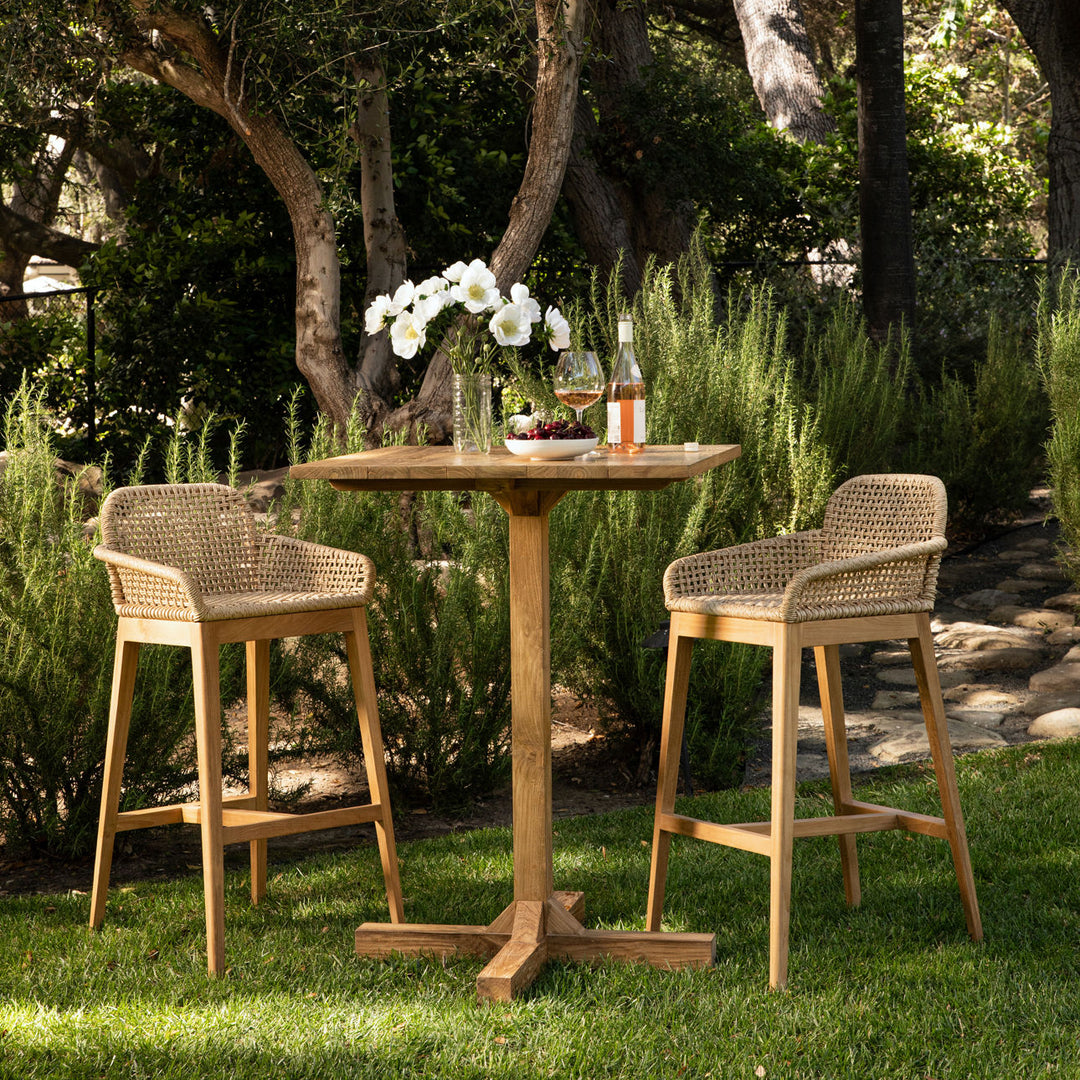 Audelle Woven Teak Outdoor Bar Stool, lifestyle view