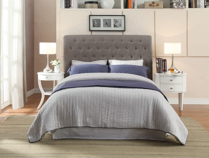 Royal Tufted Upholstered Footboard Storage Bed in Dolphin Linen styled in a bedroom