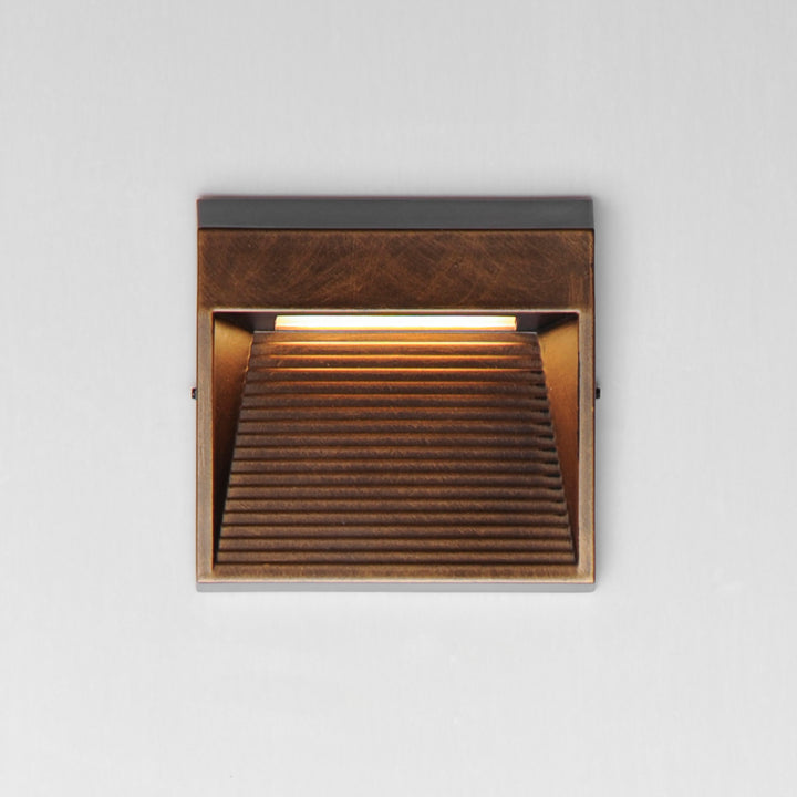 Steppes Small LED Outdoor Wall Sconce by ET2 Lighting, styled view 3