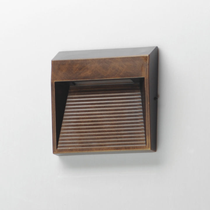 Steppes Small LED Outdoor Wall Sconce by ET2 Lighting, styled view 4