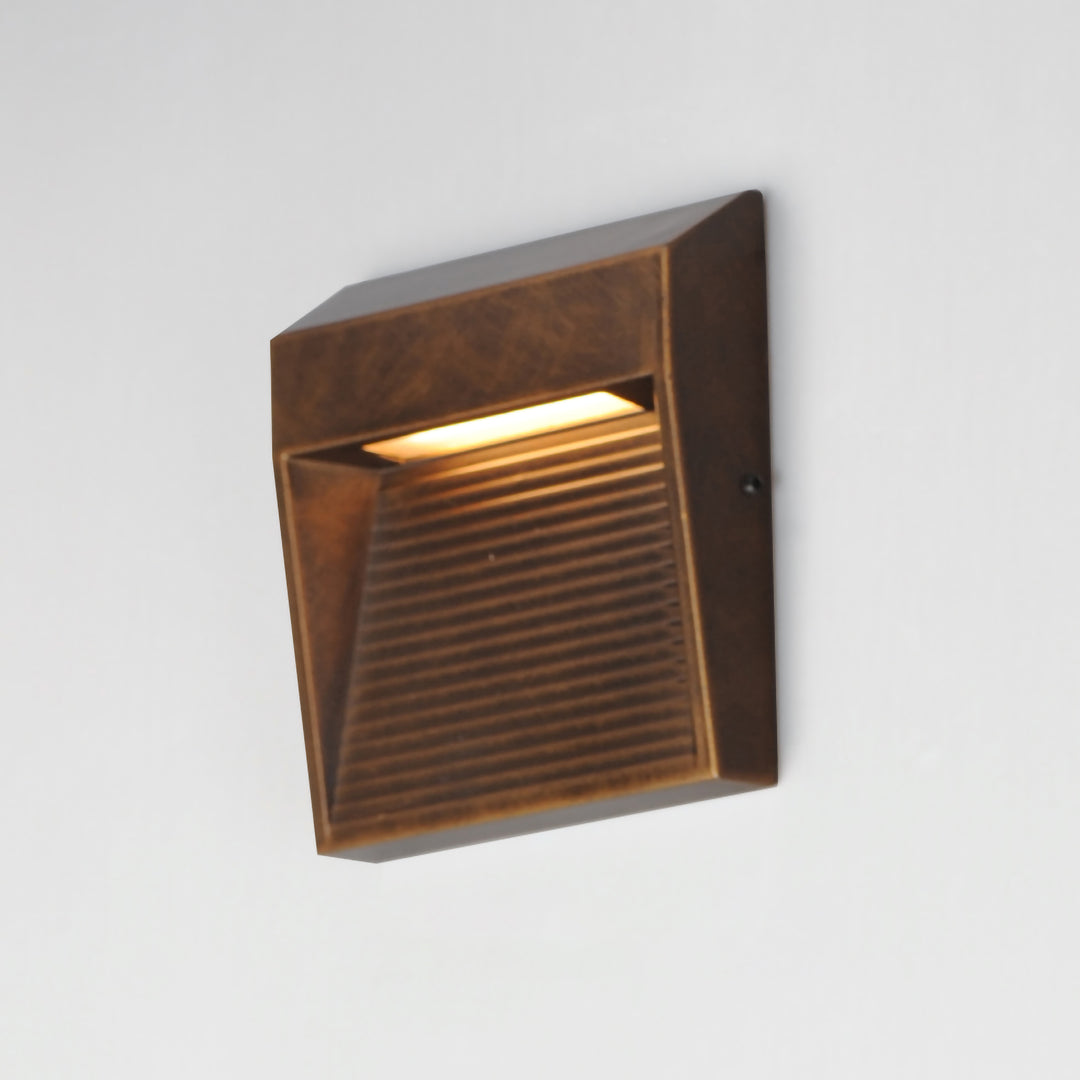 Steppes Small LED Outdoor Wall Sconce by ET2 Lighting, styled view 5