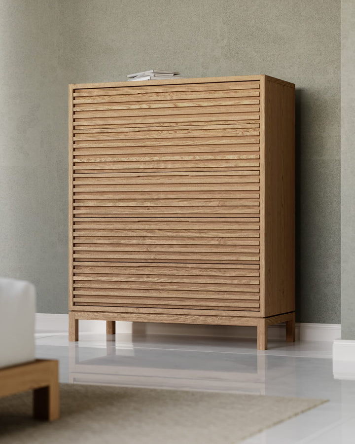 Tanner Five Drawer Chest in Flaxen — styled in a room