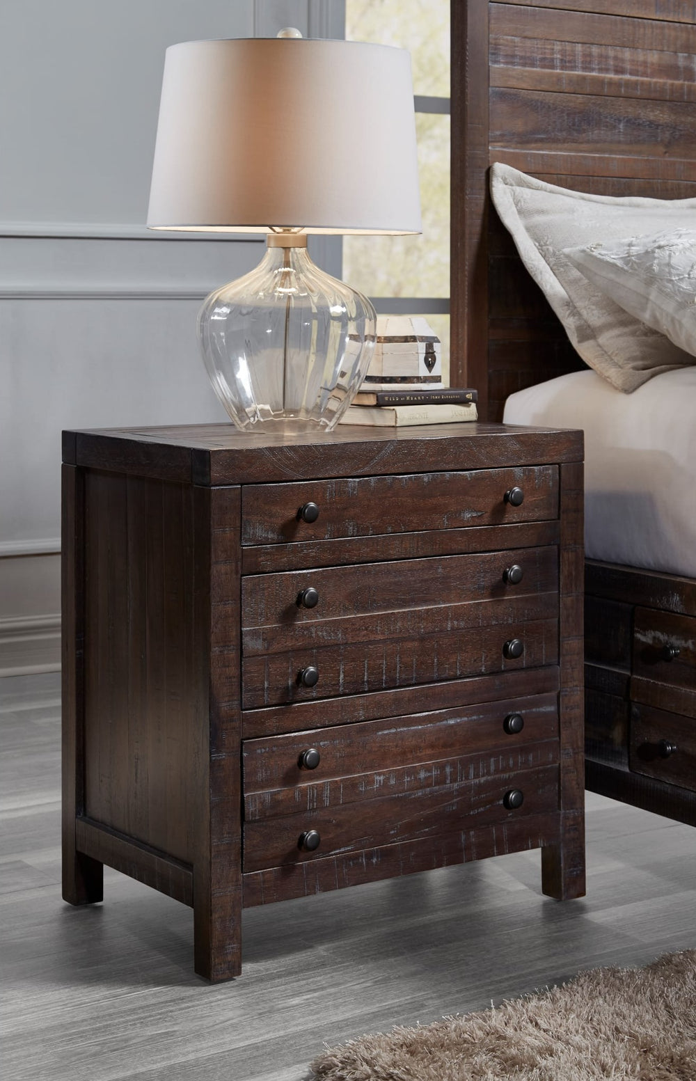 Townsend Three Drawer Solid Wood Nightstand in Java — in a bedroom setting