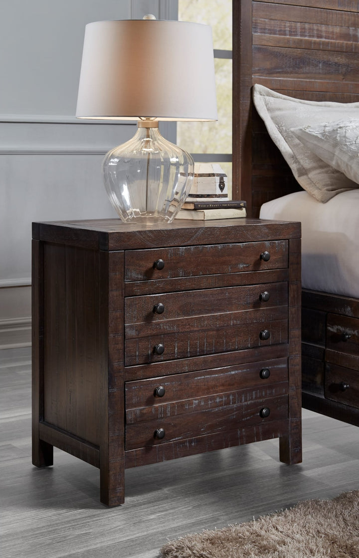 Townsend Three Drawer Solid Wood Nightstand in Java — in a bedroom setting
