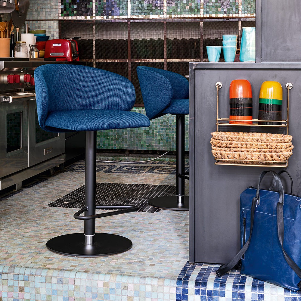 Tuka Metal Upholstered Adjustable Stool by Connubia in a styled interior