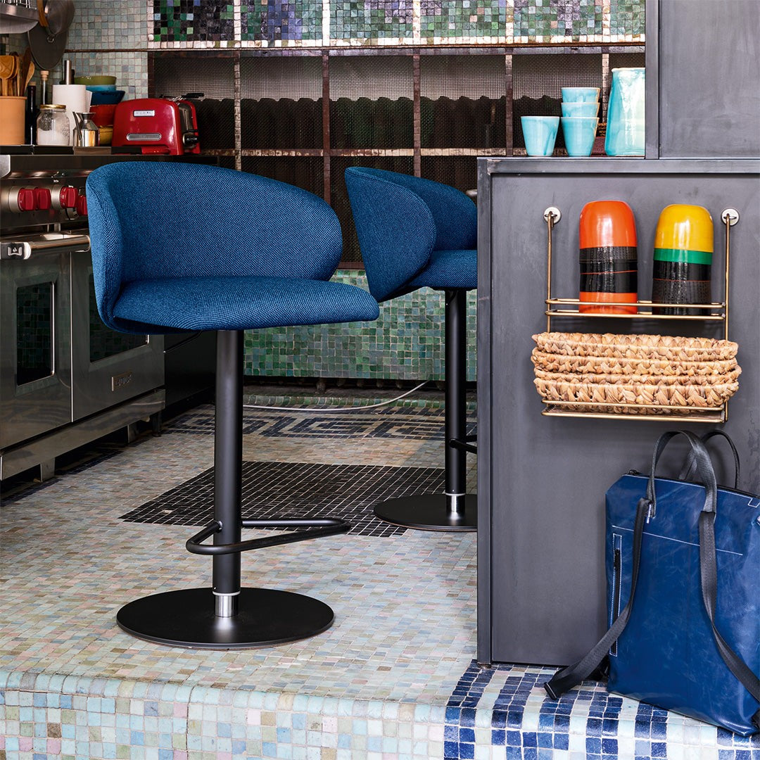 Tuka Metal Upholstered Adjustable Stool by Connubia in a styled interior