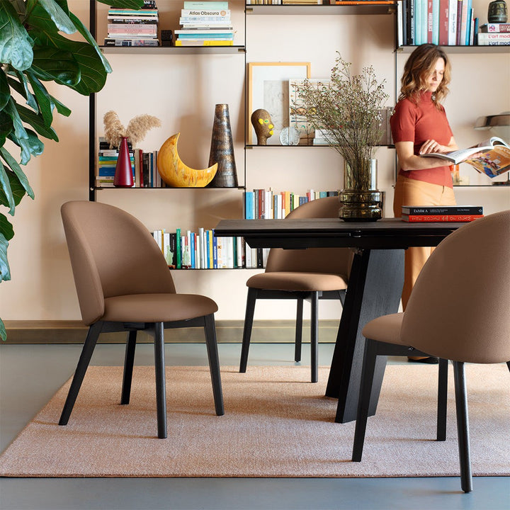 Tuka Mid Wood Dining Chair by Connubia in a styled interior