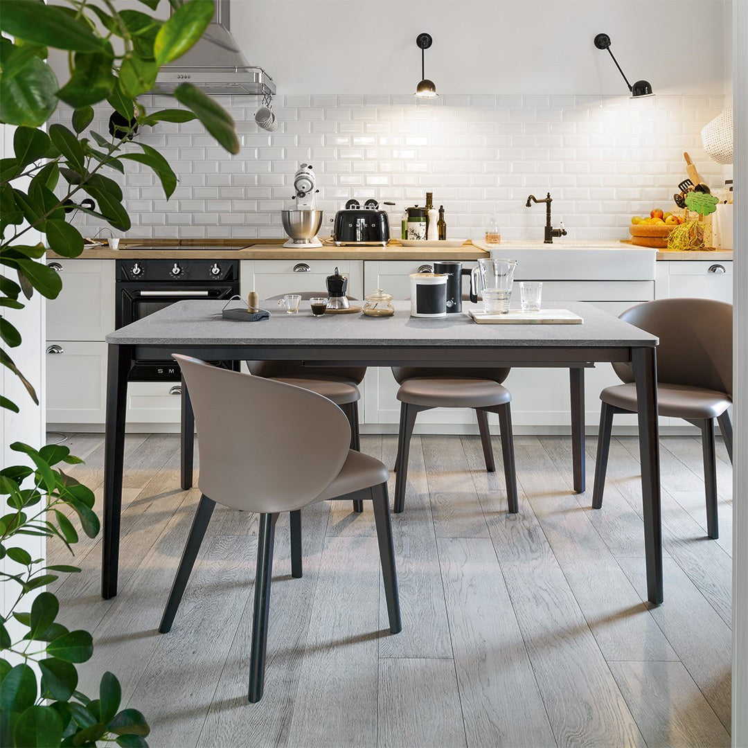 Tuka Wood Dining Armchair by Connubia in a styled interior