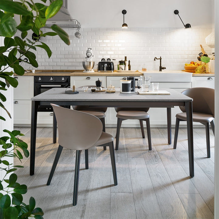 Tuka Wood Dining Armchair by Connubia in a styled interior