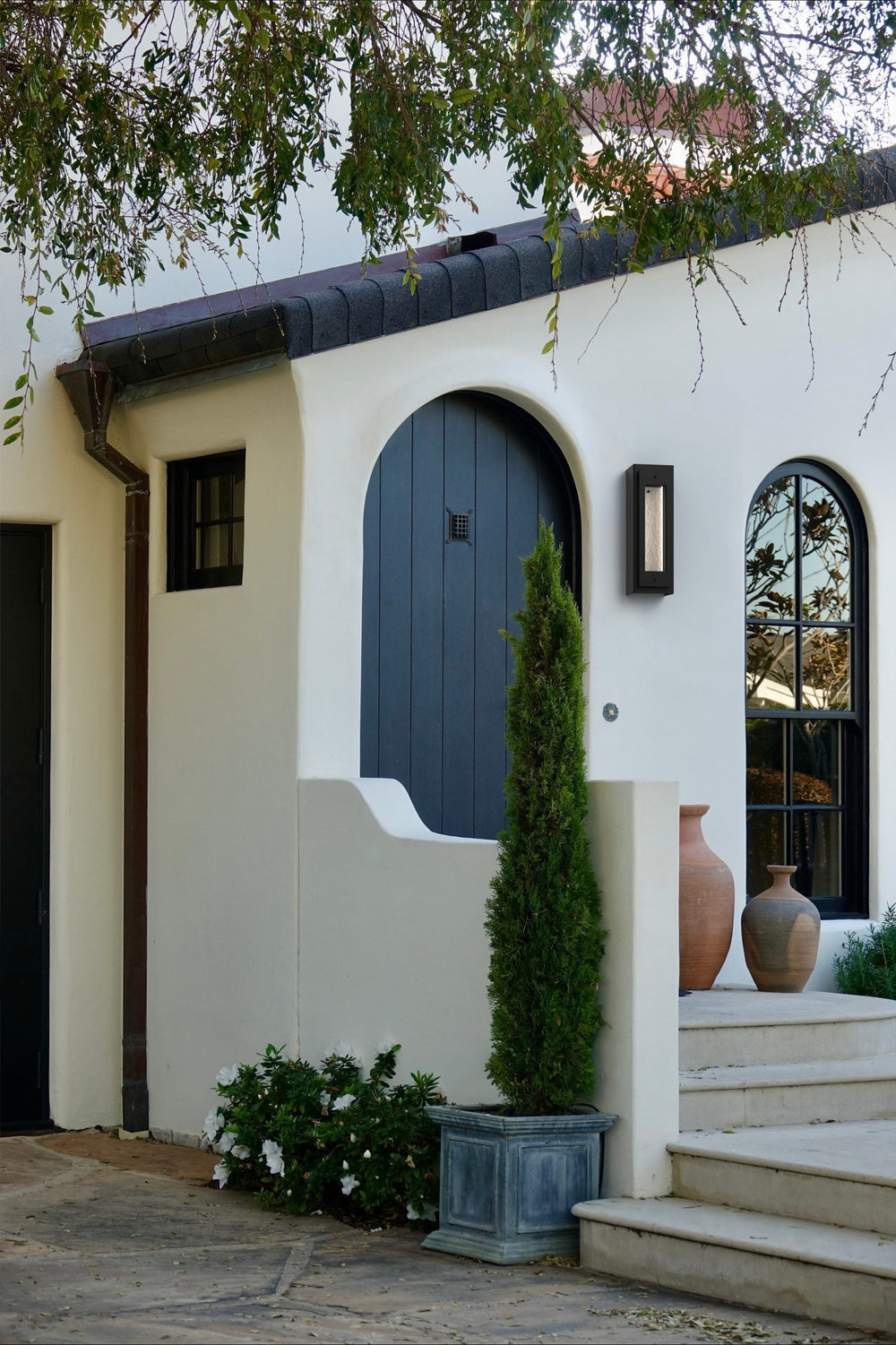 Twilight Outdoor Sconce by Hammerton Studio in a styled interior