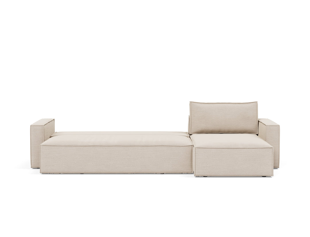 Newilla Sleeper Chaise Sectional (standard arm) by Innovation Living in Blida Sand Grey, bed position, front view on white