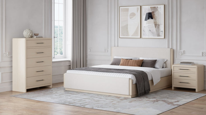 Wallen Five Drawer Chest in White Sand — in a bedroom setting