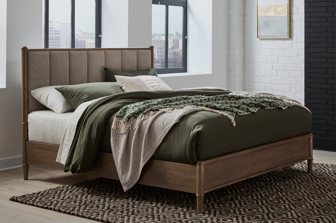 Whitmore Wood and Upholstered Bed styled in a bedroom