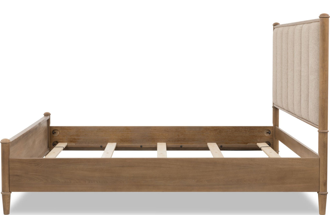 Whitmore Wood and Upholstered Bed — side view without mattress