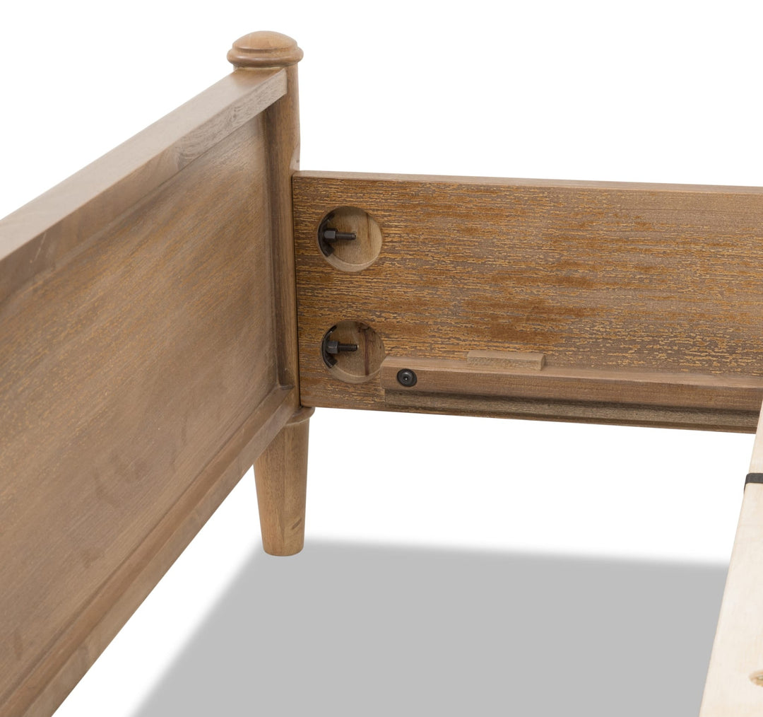 Whitmore Wood and Upholstered Bed — close-up of the headboard post and rail fitting