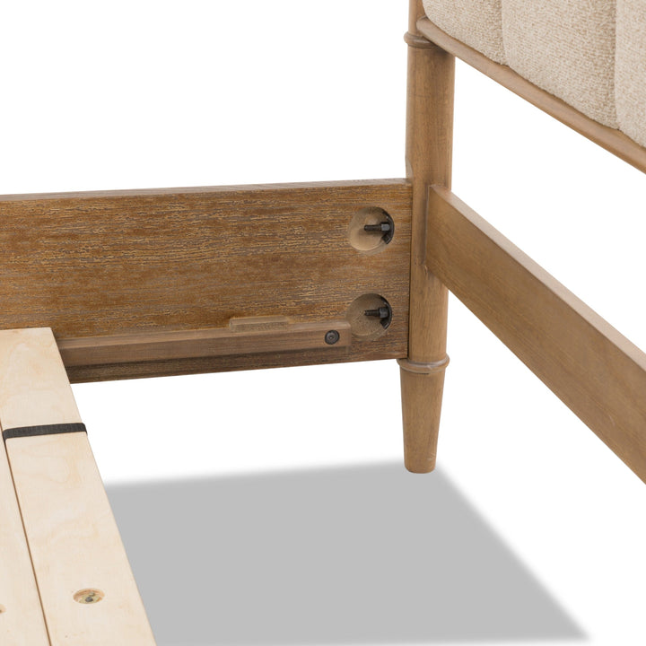 Whitmore Wood and Upholstered Bed — close-up of the leg and rail fitting